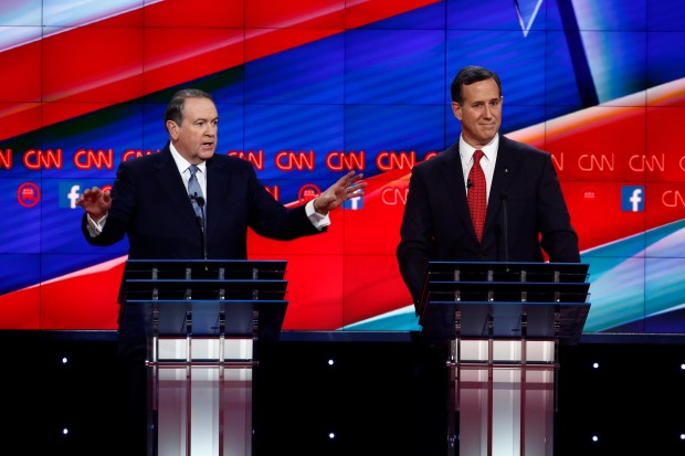 Mike Huckabee and Rick Santorum on stage at the CNN Republican Debate in Las Vegas, Nevada at the Venetian Theater in the Venetian Hotel.